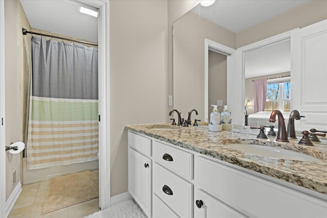 bathroom with double vanity, a sink, ensuite bath, and shower / bath combo