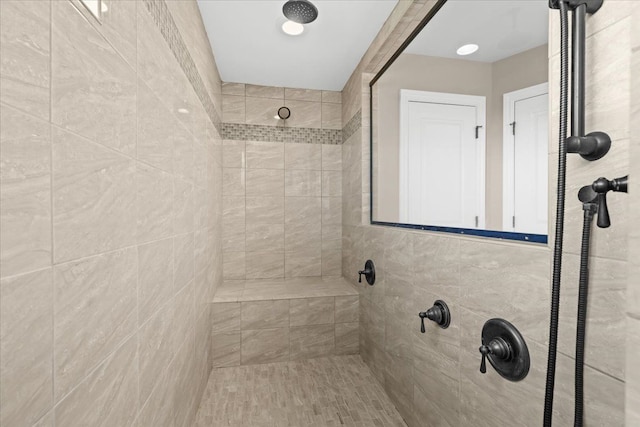 full bathroom featuring a tile shower