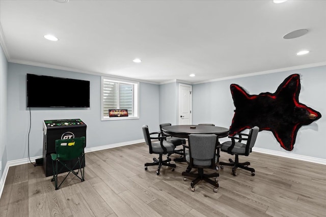 rec room with baseboards, ornamental molding, wood finished floors, and recessed lighting