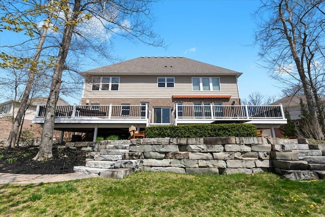 back of property with brick siding and a wooden deck
