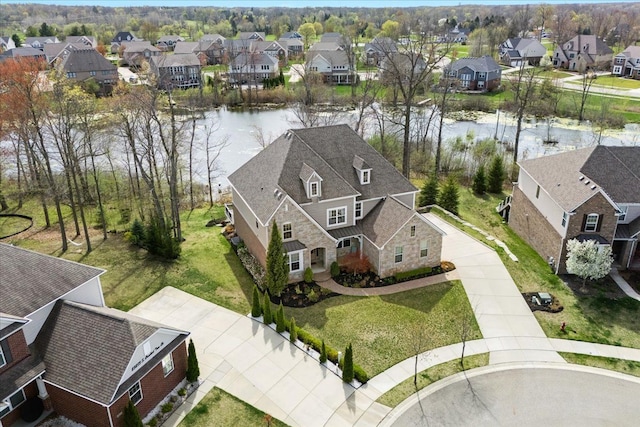 aerial view with a water view and a residential view