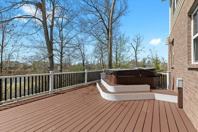 wooden terrace with a hot tub