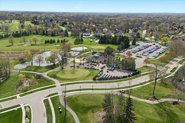 bird's eye view featuring a water view and view of golf course
