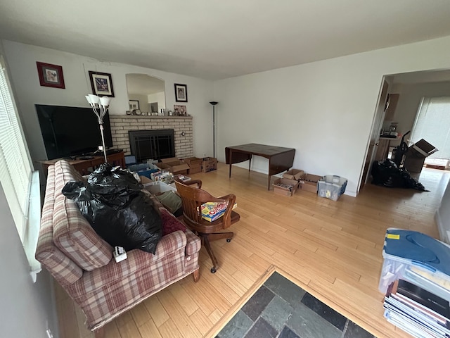 living area with wood finished floors and a fireplace