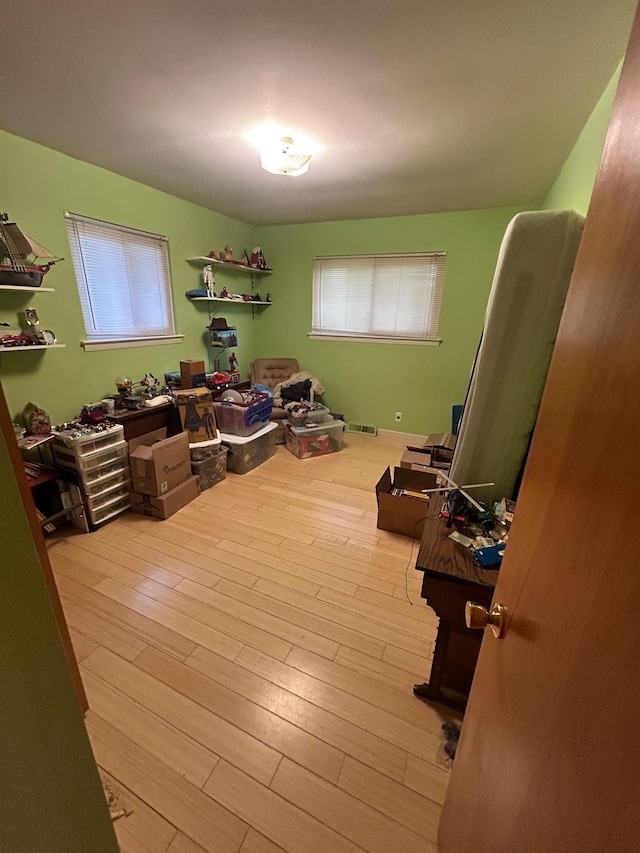 interior space featuring wood finished floors and visible vents