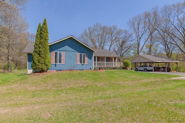 3620 Sharp Rd, Adrian, MI 49221 - view of front of house featuring covered porch, a front yard, and a detached carport