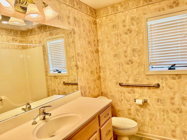 8505 Woodridge Dr, Davison, MI 48423 - bathroom with vanity, baseboards, toilet, and a shower