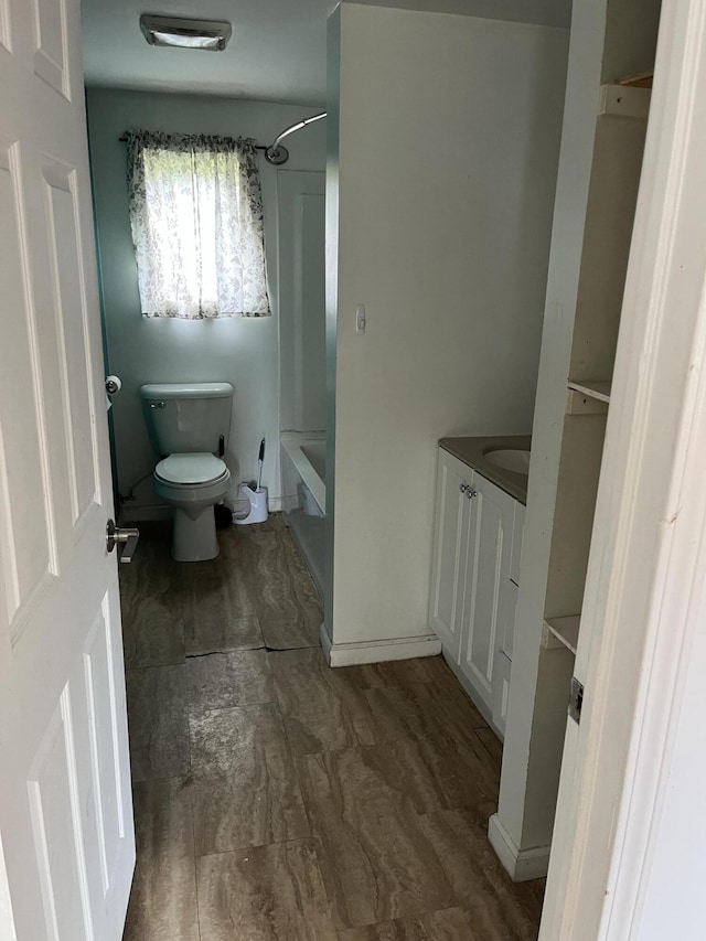 full bath with toilet, shower / tub combination, and vanity