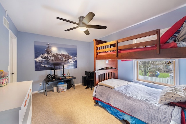 bedroom with carpet floors, baseboards, ceiling fan, and visible vents