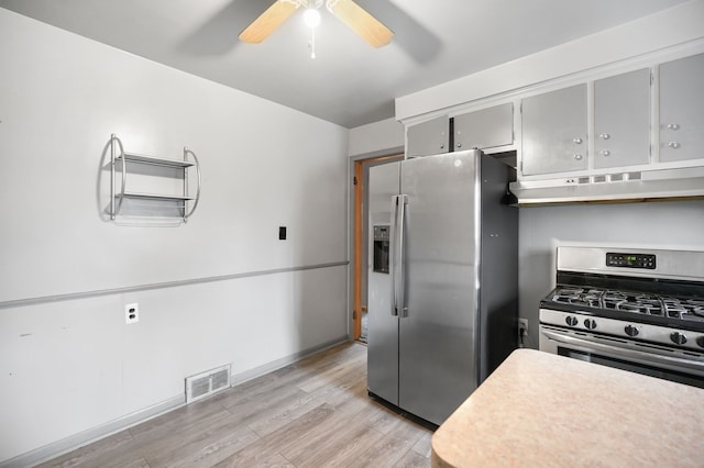 kitchen with ceiling fan, visible vents, appliances with stainless steel finishes, light wood-type flooring, and under cabinet range hood