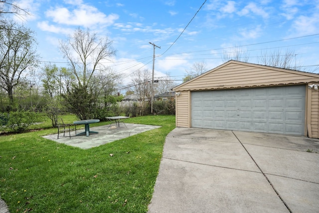 detached garage featuring fence