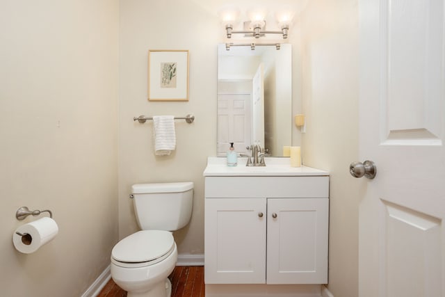 44492 Midway Dr, Novi, MI 48375 - half bathroom featuring toilet, vanity, and baseboards