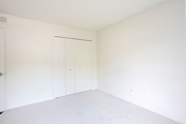 44492 Midway Dr, Novi, MI 48375 - unfurnished bedroom with carpet floors, a closet, and baseboards