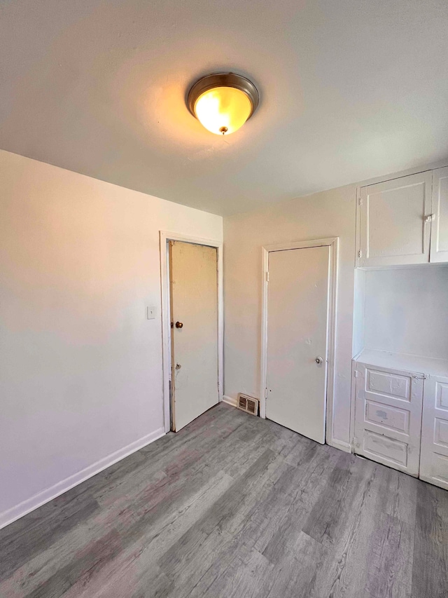 17421 Oakland St, Highland Park, MI 48203 - interior space with wood finished floors and baseboards