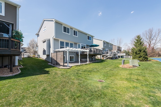rear view of property with a lawn and a pergola