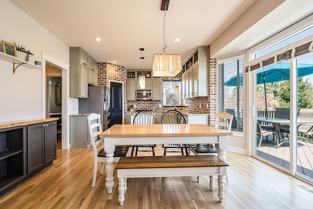 dining area featuring visible vents, recessed lighting, and light wood-style flooring