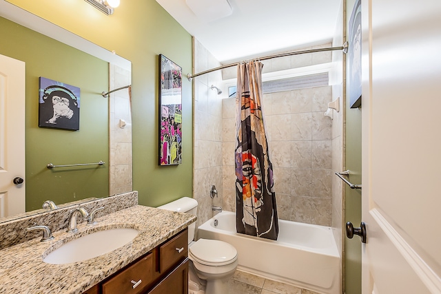 full bath featuring toilet, tile patterned floors, shower / bath combination with curtain, and vanity