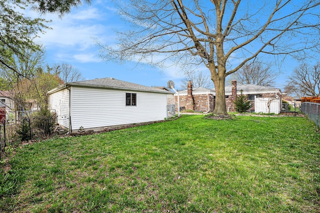 3410 Pasadena Dr, Troy, MI 48083 - view of yard with a fenced backyard and an outbuilding