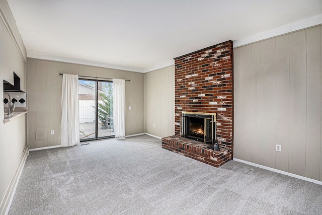 3410 Pasadena Dr, Troy, MI 48083 - unfurnished living room with crown molding, carpet floors, a brick fireplace, wood walls, and baseboards