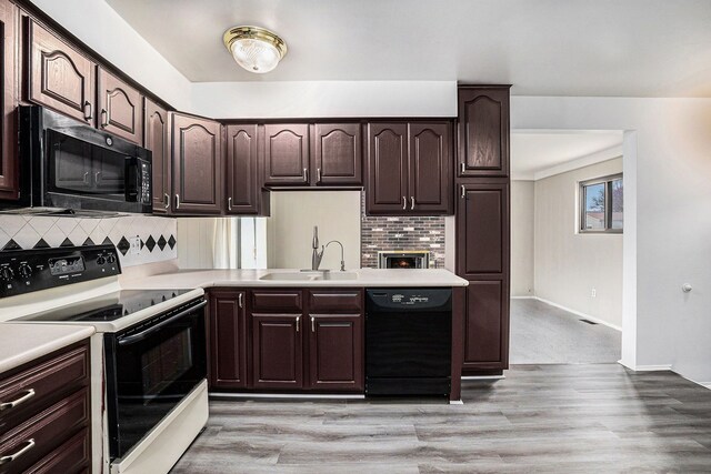 3410 Pasadena Dr, Troy, MI 48083 - kitchen with electric range, light countertops, tasteful backsplash, a sink, and dishwasher