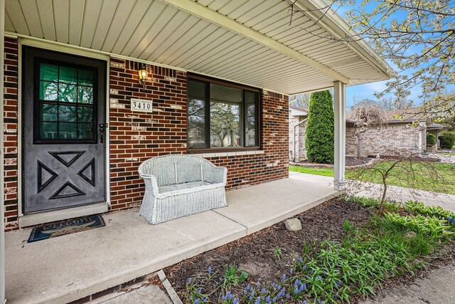 3410 Pasadena Dr, Troy, MI 48083 - view of exterior entry with a porch and brick siding