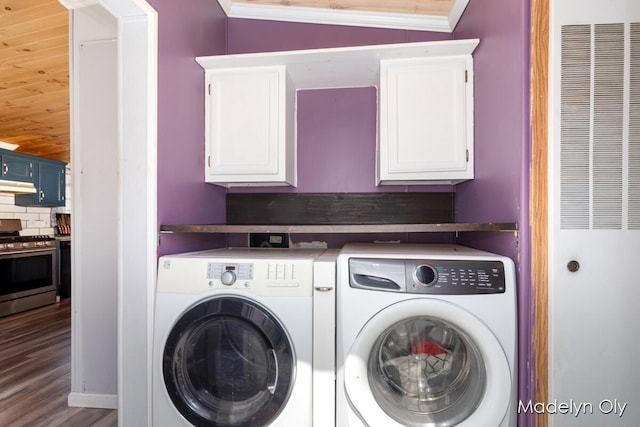 washroom with cabinet space, separate washer and dryer, crown molding, and a heating unit
