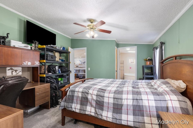 bedroom featuring ornamental molding, a textured ceiling, and carpet