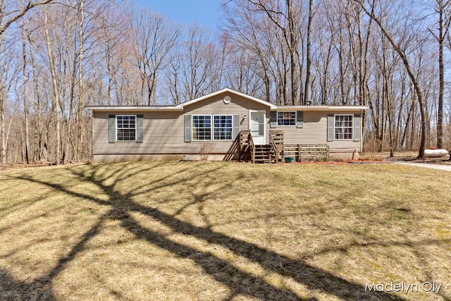 view of front of home with a front yard