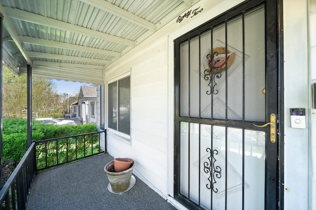 view of exterior entry featuring a porch