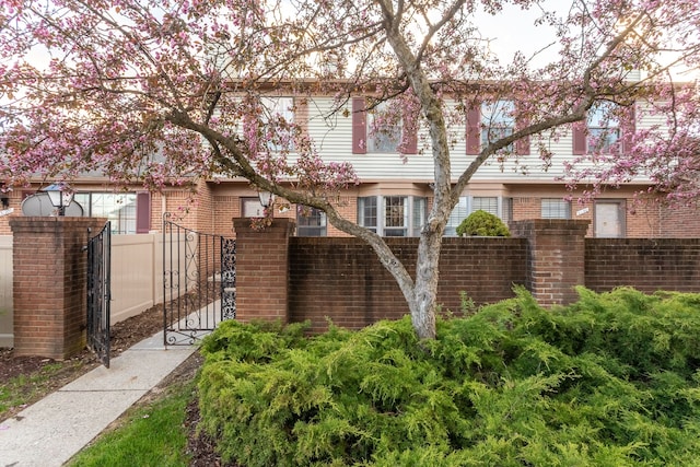 31198 Country Way Unit 27, Farmington Hills, MI 48331 - view of front of property with a gate, brick siding, and fence