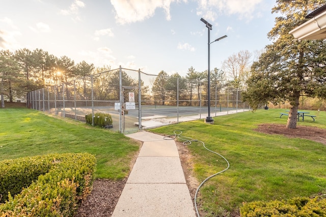 31198 Country Way Unit 27, Farmington Hills, MI 48331 - view of tennis court with a lawn, fence, and a gate