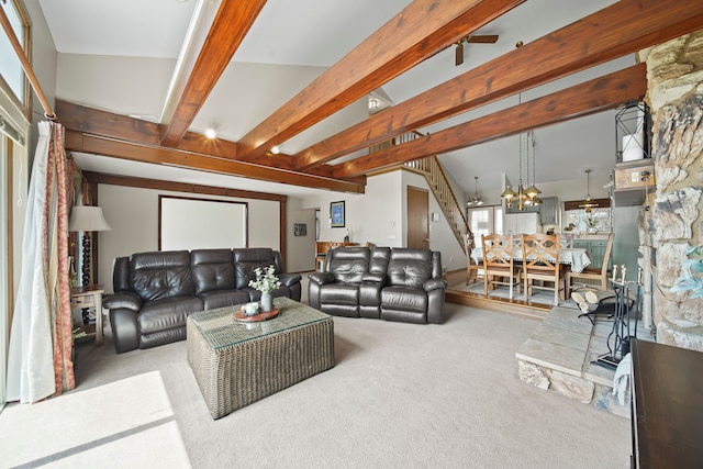 living room with stairway, carpet, beam ceiling, and a chandelier