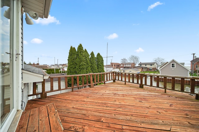 wooden deck featuring a residential view
