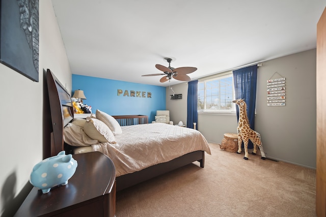 bedroom featuring a ceiling fan and carpet