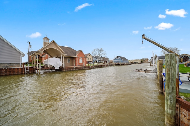 exterior space featuring a water view and boat lift