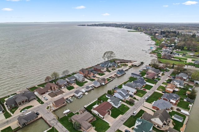 bird's eye view with a residential view and a water view