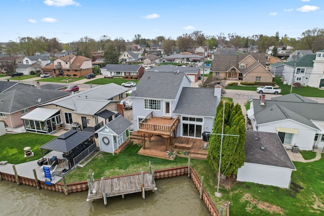 aerial view featuring a water view and a residential view