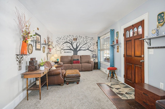 carpeted living room with baseboards