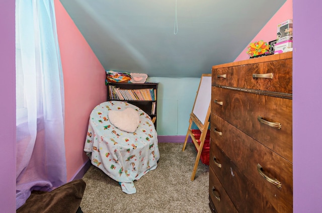 bedroom with carpet floors, baseboards, and vaulted ceiling