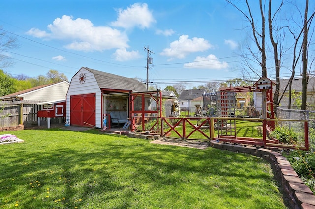 view of yard with a fenced backyard, an outdoor structure, and a shed