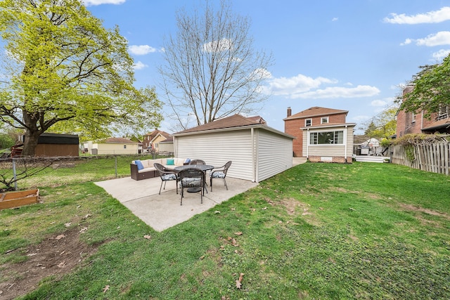 view of yard with an outdoor structure, a patio area, an outdoor hangout area, and a fenced backyard