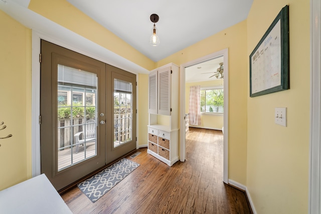 doorway to outside featuring wood finished floors, french doors, visible vents, and baseboards