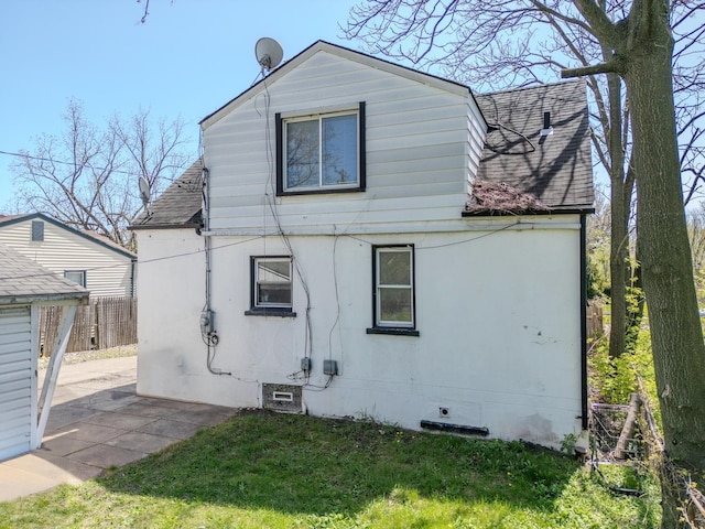 13705 Julius Ave, Warren, MI 48089 - rear view of property with roof with shingles and a patio