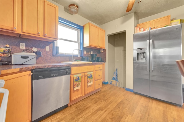 13705 Julius Ave, Warren, MI 48089 - kitchen featuring appliances with stainless steel finishes, a sink, light wood finished floors, light brown cabinets, and backsplash