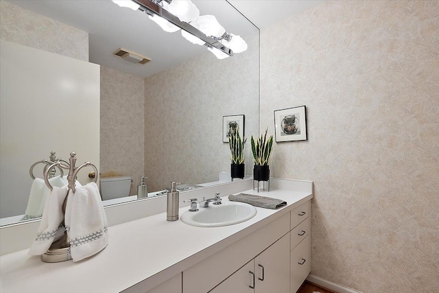 bathroom featuring vanity and visible vents