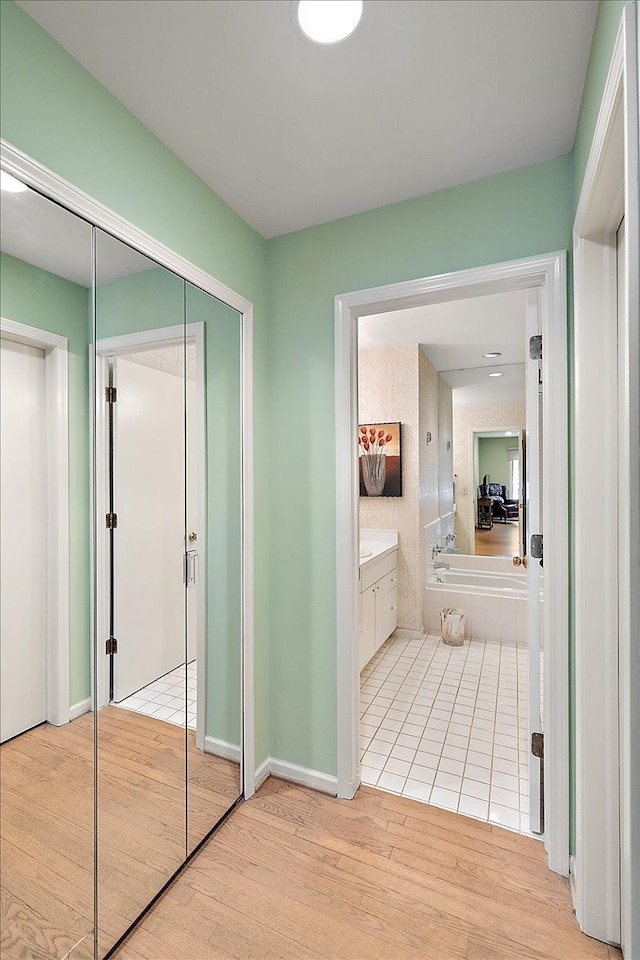 corridor with wood finished floors