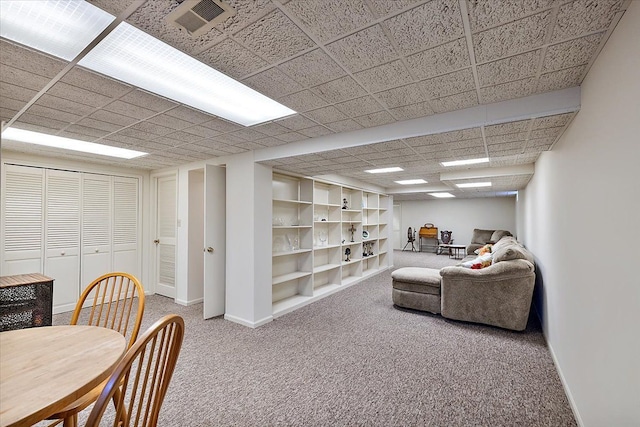 living room featuring carpet floors, baseboards, and visible vents