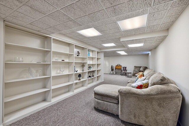 sitting room with carpet flooring and a paneled ceiling