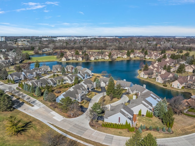 birds eye view of property featuring a water view and a residential view