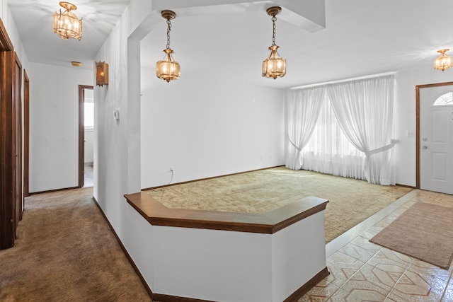 15895 Bexley St, Clinton Township, MI 48038 - carpeted foyer featuring a chandelier and baseboards